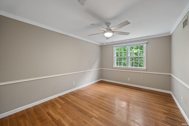 201 Colony Rd, West Lafayette, IN 47906 - unfurnished room with baseboards, a smoke detector, wood finished floors, a ceiling fan, and crown molding
