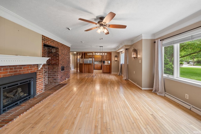 201 Colony Rd, West Lafayette, IN 47906 - unfurnished living room with a fireplace, a baseboard radiator, light wood-style flooring, crown molding, and ceiling fan