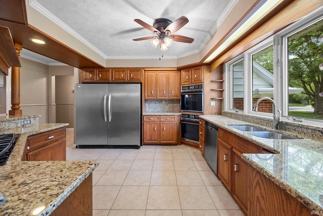 201 Colony Rd, West Lafayette, IN 47906 - kitchen with appliances with stainless steel finishes, a sink, brown cabinets, light tile patterned flooring, and decorative backsplash
