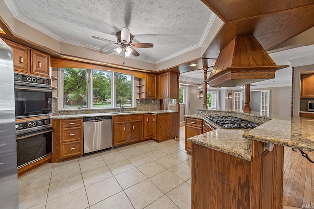 201 Colony Rd, West Lafayette, IN 47906 - kitchen with stainless steel dishwasher, brown cabinetry, crown molding, backsplash, and a textured ceiling