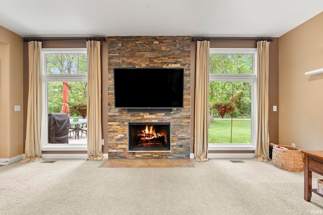 15829 Winterberry Ct, Huntertown, IN 46748 - living room with carpet, a fireplace, and plenty of natural light