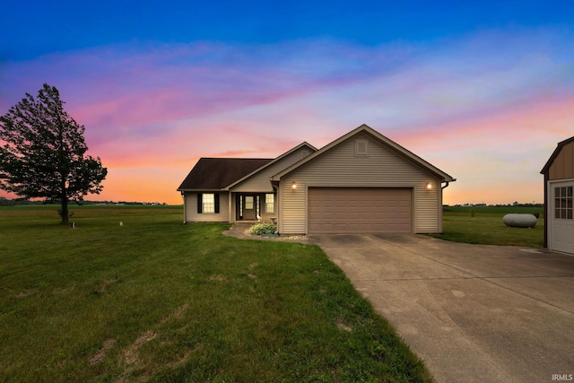 8633 State Rd 28 E, Clarks Hill, IN 47930 - single story home featuring concrete driveway, a garage, and a lawn