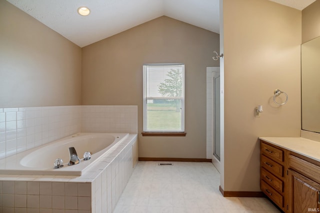 8633 State Rd 28 E, Clarks Hill, IN 47930 - bathroom featuring a bath, vanity, vaulted ceiling, baseboards, and a shower
