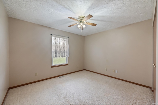 8633 State Rd 28 E, Clarks Hill, IN 47930 - unfurnished room featuring light colored carpet, a ceiling fan, baseboards, and a textured ceiling