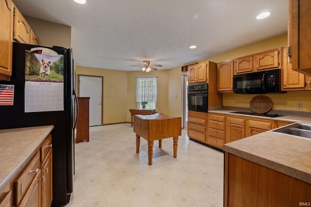 8633 State Rd 28 E, Clarks Hill, IN 47930 - kitchen with black appliances, light floors, recessed lighting, a ceiling fan, and light countertops