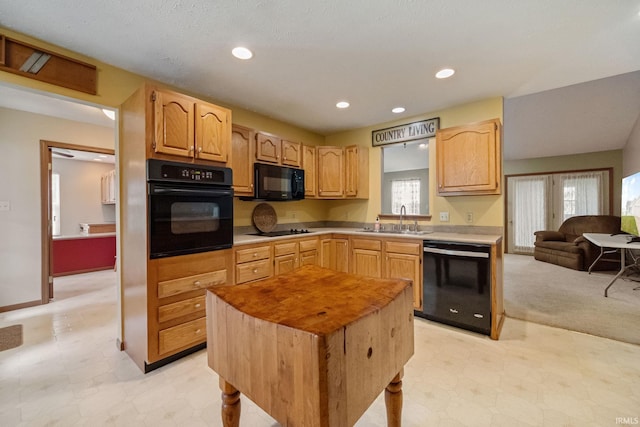 8633 State Rd 28 E, Clarks Hill, IN 47930 - kitchen with black appliances, a sink, light floors, light countertops, and recessed lighting