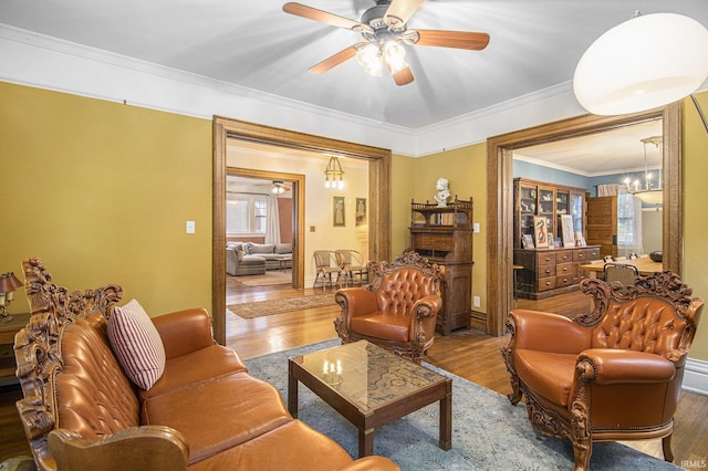 831 W Colfax Ave, South Bend, IN 46601 - living room with ceiling fan, wood finished floors, ornamental molding, and plenty of natural light