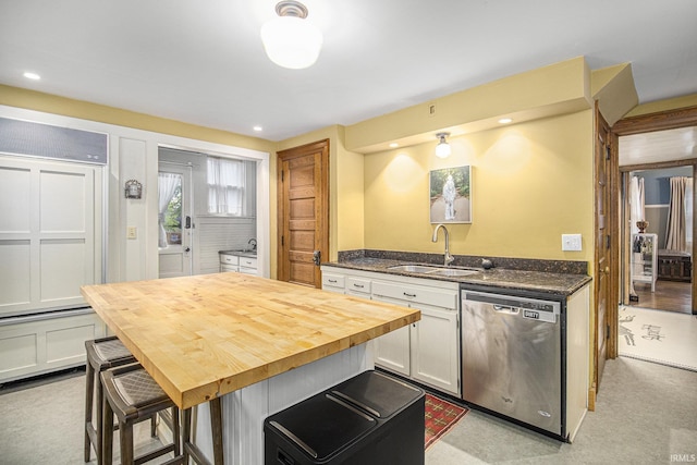 831 W Colfax Ave, South Bend, IN 46601 - kitchen with dishwasher, a sink, butcher block counters, white cabinets, and recessed lighting