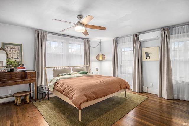 831 W Colfax Ave, South Bend, IN 46601 - bedroom with a wall mounted AC, wood finished floors, a ceiling fan, and ornamental molding