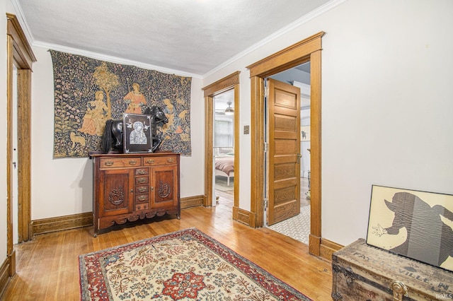 831 W Colfax Ave, South Bend, IN 46601 - hallway with wood-type flooring, ornamental molding, and baseboards