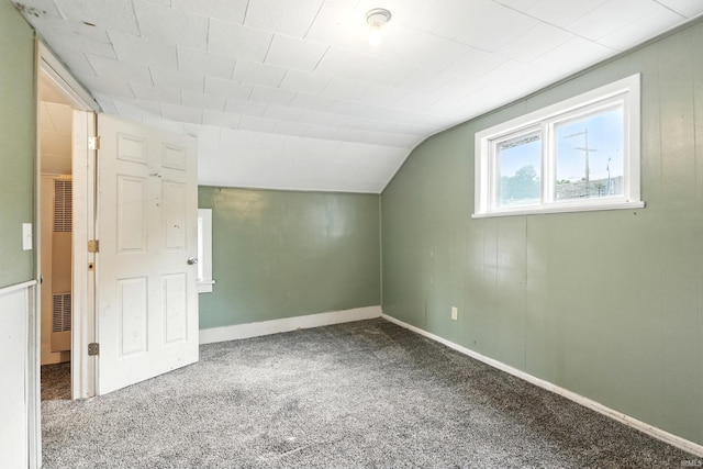 211 N Poplar St, Lagrange, IN 46761 - bonus room featuring a heating unit, carpet floors, lofted ceiling, and baseboards