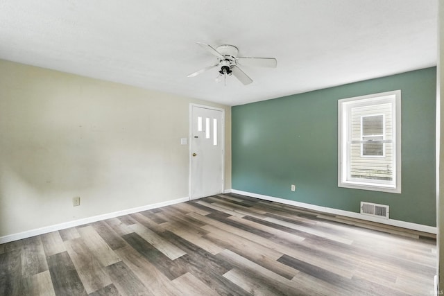 211 N Poplar St, Lagrange, IN 46761 - unfurnished room featuring ceiling fan, wood finished floors, and baseboards