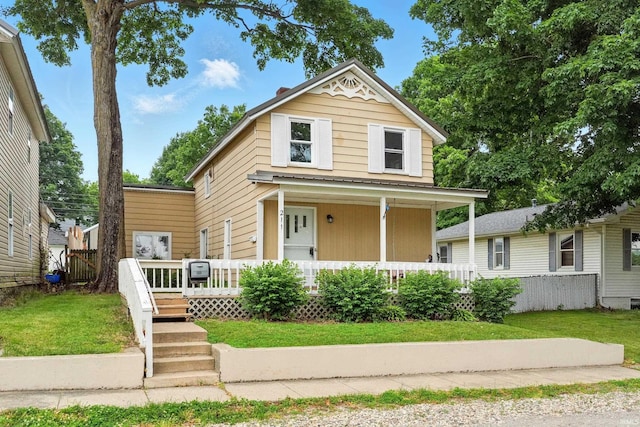 211 N Poplar St, Lagrange, IN 46761 - view of front facade with a front lawn and covered porch