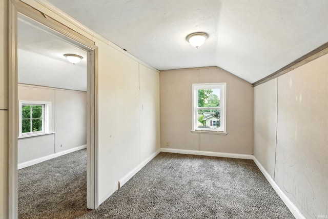 211 N Poplar St, Lagrange, IN 46761 - carpeted spare room with vaulted ceiling, healthy amount of natural light, and baseboards
