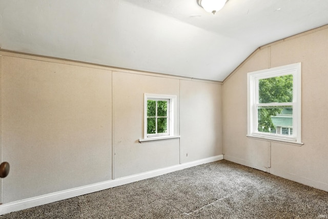 211 N Poplar St, Lagrange, IN 46761 - spare room with healthy amount of natural light, vaulted ceiling, and carpet