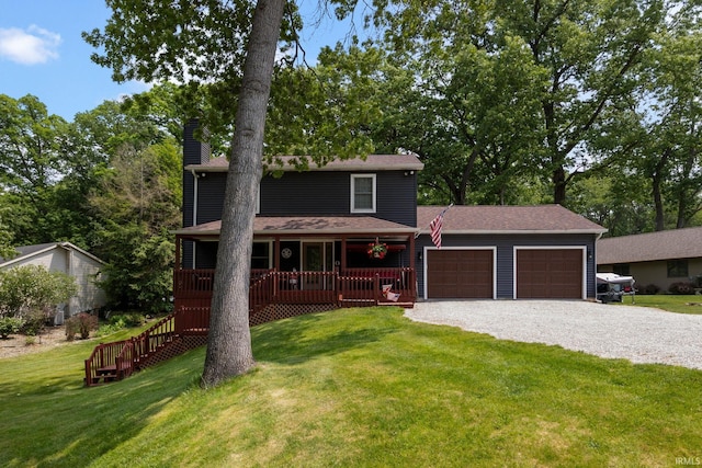 30986 Creekwood Ter, Osceola, IN 46561 - view of front of house featuring a chimney, a garage, driveway, covered porch, and a front yard