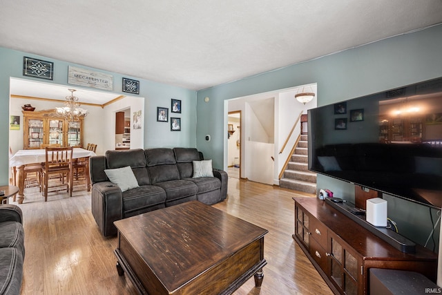 30986 Creekwood Ter, Osceola, IN 46561 - living room with stairs, wood finished floors, and a chandelier