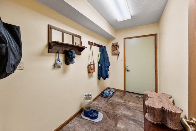 30986 Creekwood Ter, Osceola, IN 46561 - doorway with baseboards and stone finish floors