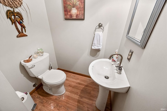 30986 Creekwood Ter, Osceola, IN 46561 - half bathroom with wood finished floors, toilet, and baseboards