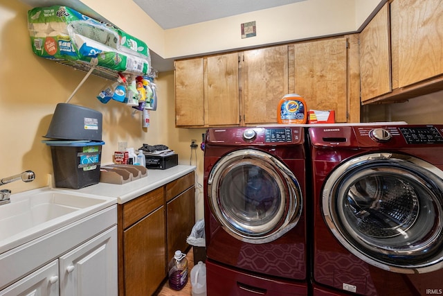 30986 Creekwood Ter, Osceola, IN 46561 - laundry area with washer and clothes dryer and cabinet space