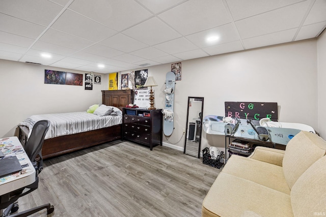 30986 Creekwood Ter, Osceola, IN 46561 - bedroom with wood finished floors, a paneled ceiling, and baseboards