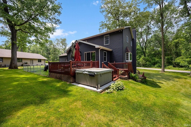 30986 Creekwood Ter, Osceola, IN 46561 - rear view of house with a hot tub and a wooden deck