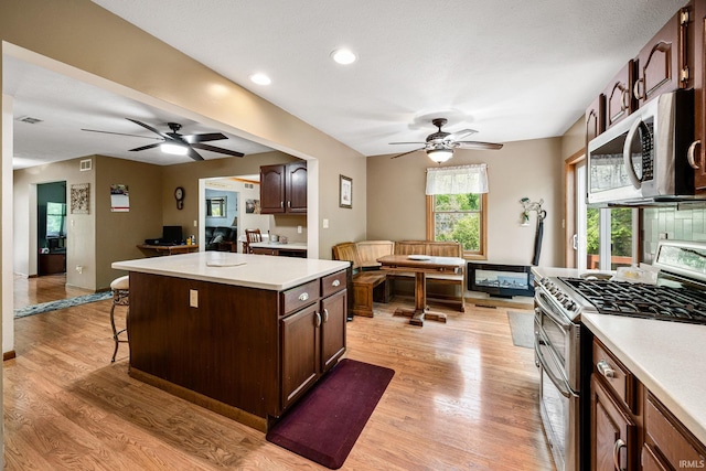 30986 Creekwood Ter, Osceola, IN 46561 - kitchen featuring stainless steel appliances, ceiling fan, light countertops, light wood-style floors, and recessed lighting