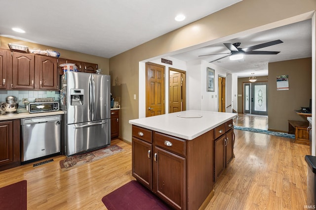 30986 Creekwood Ter, Osceola, IN 46561 - kitchen with stainless steel appliances, light countertops, and light wood-type flooring
