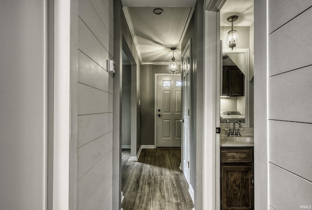 1212 Summit Ave, Bluffton, IN 46714 - corridor featuring a sink, dark wood finished floors, crown molding, and baseboards
