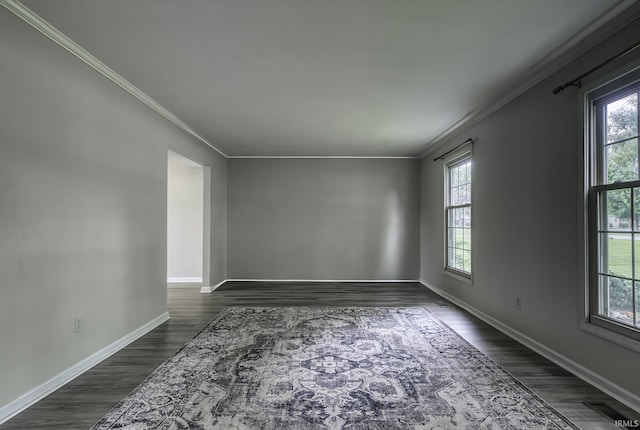 1212 Summit Ave, Bluffton, IN 46714 - unfurnished room featuring ornamental molding, plenty of natural light, baseboards, and dark wood-style floors