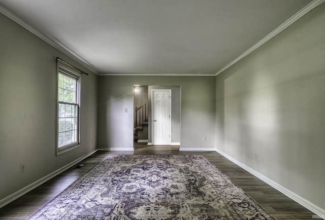 1212 Summit Ave, Bluffton, IN 46714 - unfurnished room with crown molding, dark wood-style flooring, baseboards, and stairway