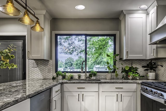 1212 Summit Ave, Bluffton, IN 46714 - kitchen featuring a sink, white cabinets, tasteful backsplash, wall chimney range hood, and recessed lighting