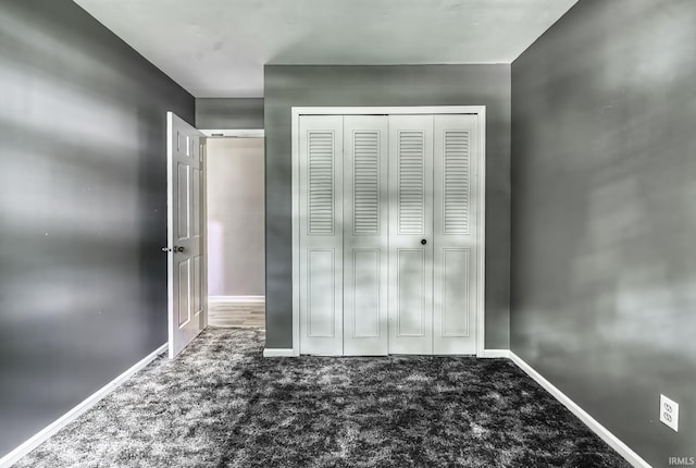 1212 Summit Ave, Bluffton, IN 46714 - unfurnished bedroom featuring carpet, a closet, and baseboards