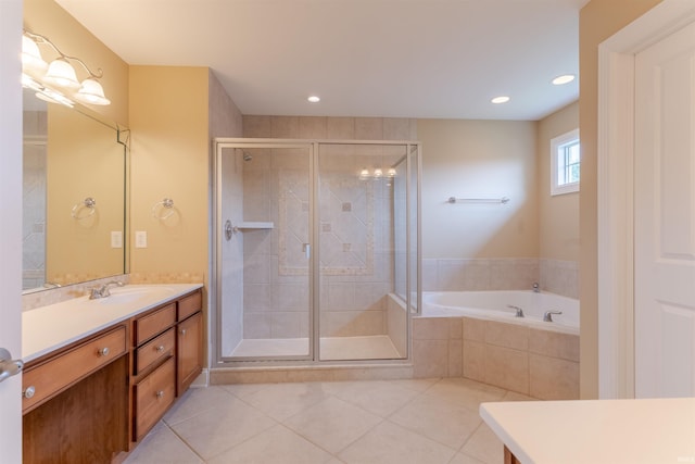 9081 Halston Cir, Newburgh, IN 47630 - bathroom with vanity, tile patterned flooring, a bath, a stall shower, and recessed lighting