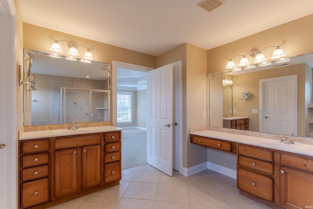 9081 Halston Cir, Newburgh, IN 47630 - full bath with a stall shower, tile patterned flooring, two vanities, and baseboards