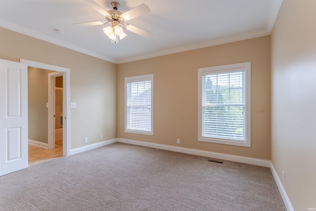 9081 Halston Cir, Newburgh, IN 47630 - spare room featuring light carpet, crown molding, plenty of natural light, and baseboards