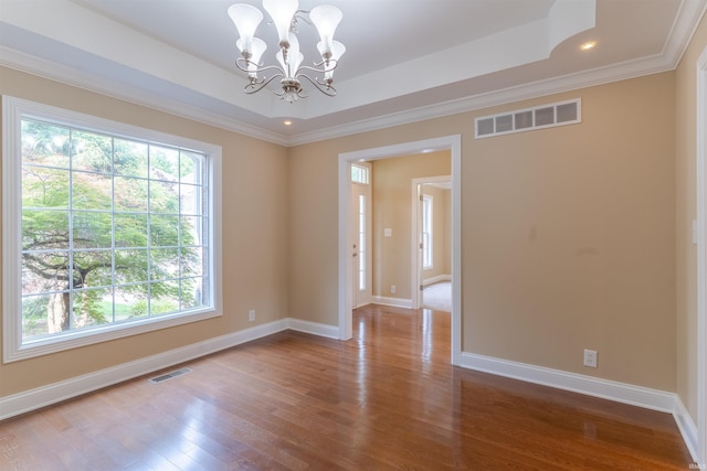 9081 Halston Cir, Newburgh, IN 47630 - spare room featuring wood finished floors, a raised ceiling, baseboards, ornamental molding, and recessed lighting