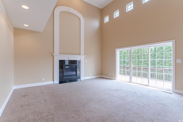 9081 Halston Cir, Newburgh, IN 47630 - unfurnished living room featuring carpet floors, a towering ceiling, baseboards, ornamental molding, and recessed lighting