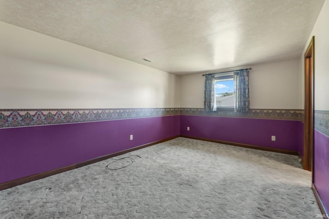 120 Cord Pl, Auburn, IN 46706 - carpeted empty room featuring a wainscoted wall, a textured ceiling, and baseboards