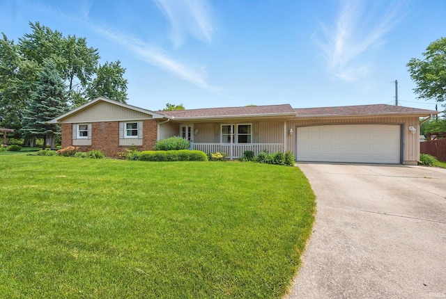 120 Cord Pl, Auburn, IN 46706 - ranch-style house with covered porch, a garage, driveway, and a front yard