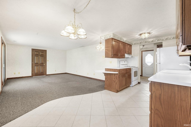 120 Cord Pl, Auburn, IN 46706 - kitchen with white electric range, light countertops, under cabinet range hood, a sink, and a chandelier