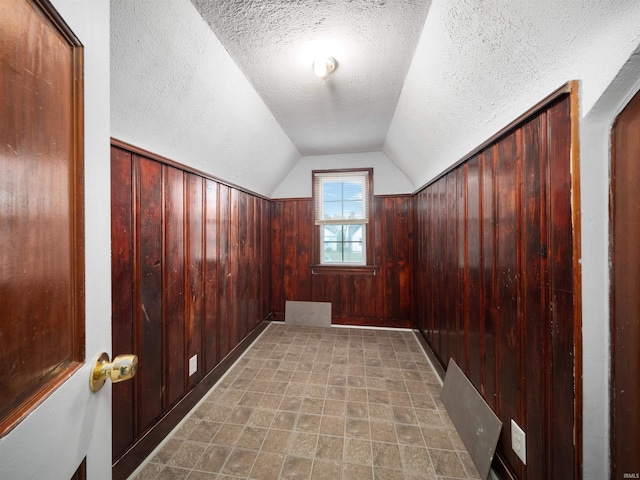 4522 S Calhoun St, Fort Wayne, IN 46807 - entryway with a textured ceiling, wood walls, and vaulted ceiling
