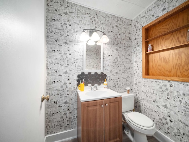 4522 S Calhoun St, Fort Wayne, IN 46807 - bathroom with vanity, toilet, and wallpapered walls