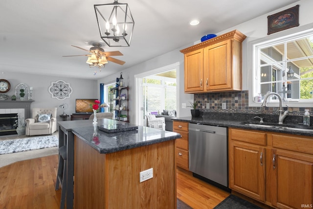 18165 Farmington Hills Dr, South Bend, IN 46637 - kitchen with dishwasher, a sink, open floor plan, light wood finished floors, and recessed lighting