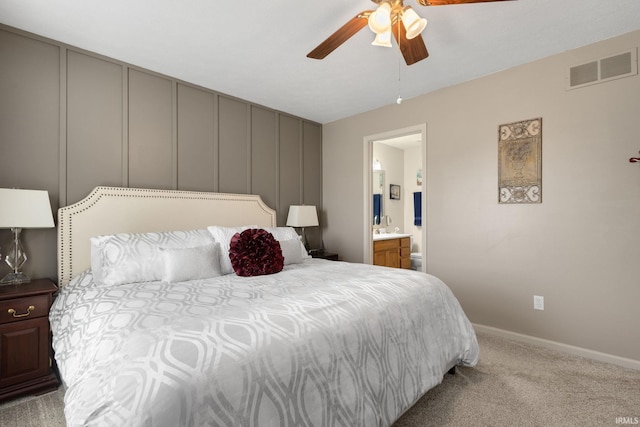 18165 Farmington Hills Dr, South Bend, IN 46637 - bedroom with baseboards, carpet flooring, ensuite bathroom, a decorative wall, and a ceiling fan