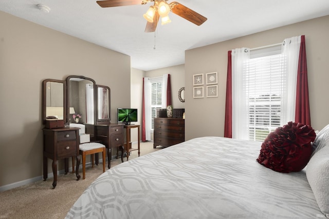 18165 Farmington Hills Dr, South Bend, IN 46637 - carpeted bedroom featuring multiple windows, ceiling fan, and baseboards
