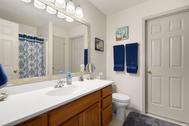 18165 Farmington Hills Dr, South Bend, IN 46637 - bathroom with vanity, toilet, and tile patterned flooring