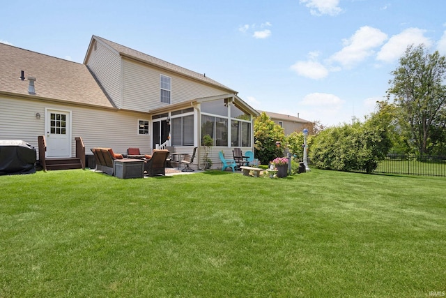 18165 Farmington Hills Dr, South Bend, IN 46637 - rear view of house with a sunroom, roof with shingles, an outdoor fire pit, and a patio