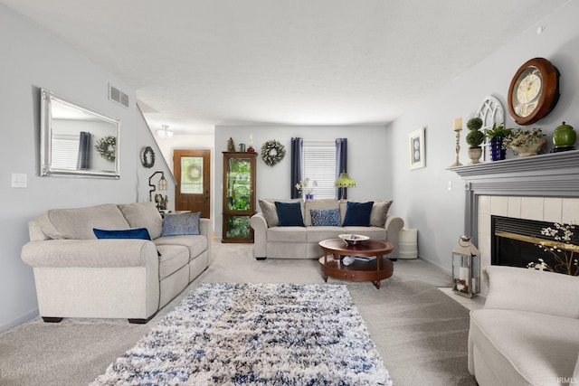 18165 Farmington Hills Dr, South Bend, IN 46637 - carpeted living room featuring a tiled fireplace and baseboards