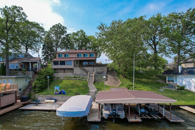 5547 N W Shafer Dr, Monticello, IN 47960 - dock with boat lift, a water view, stairs, and a yard
